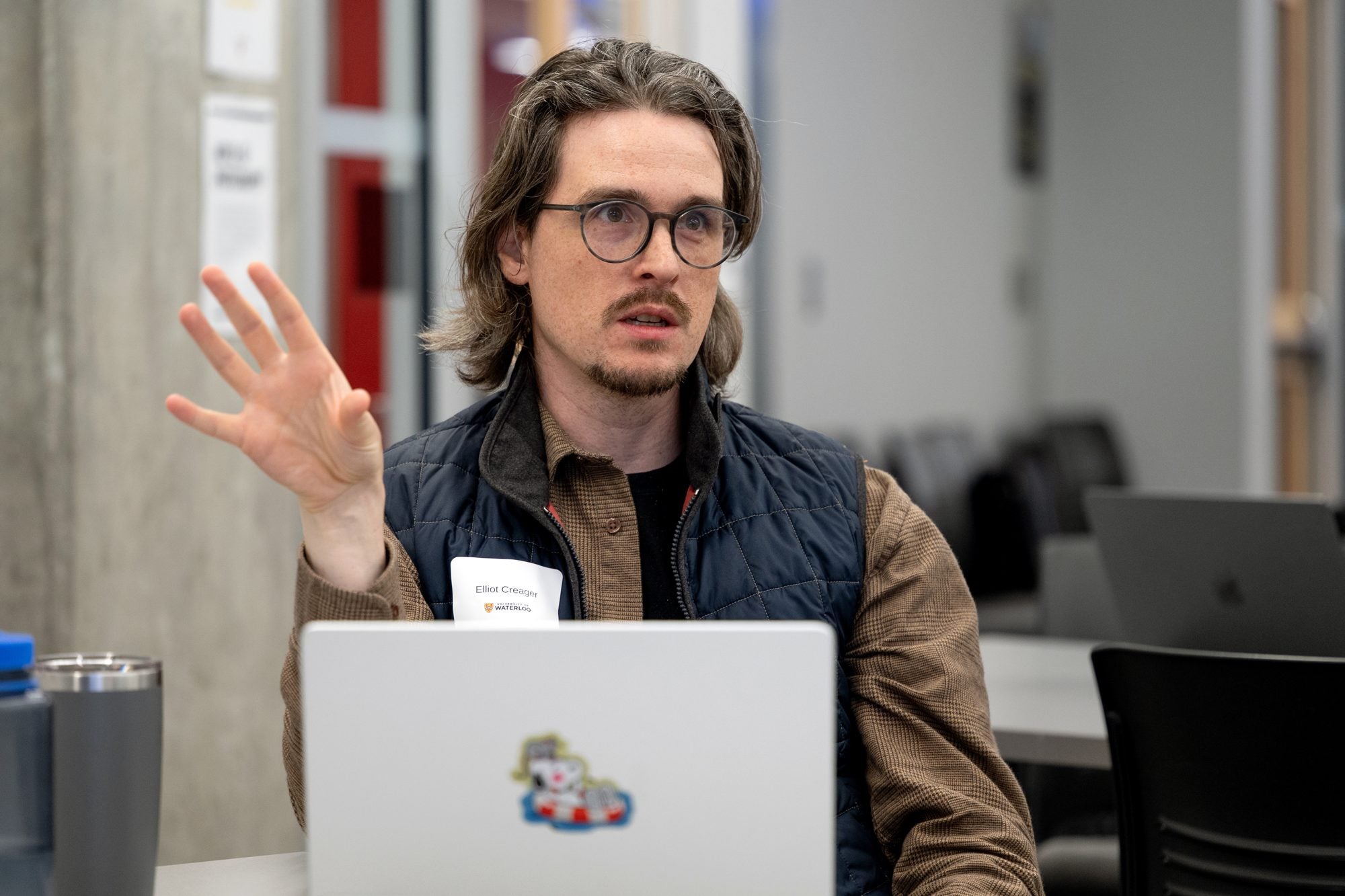 An attendee asks a question during a presentation