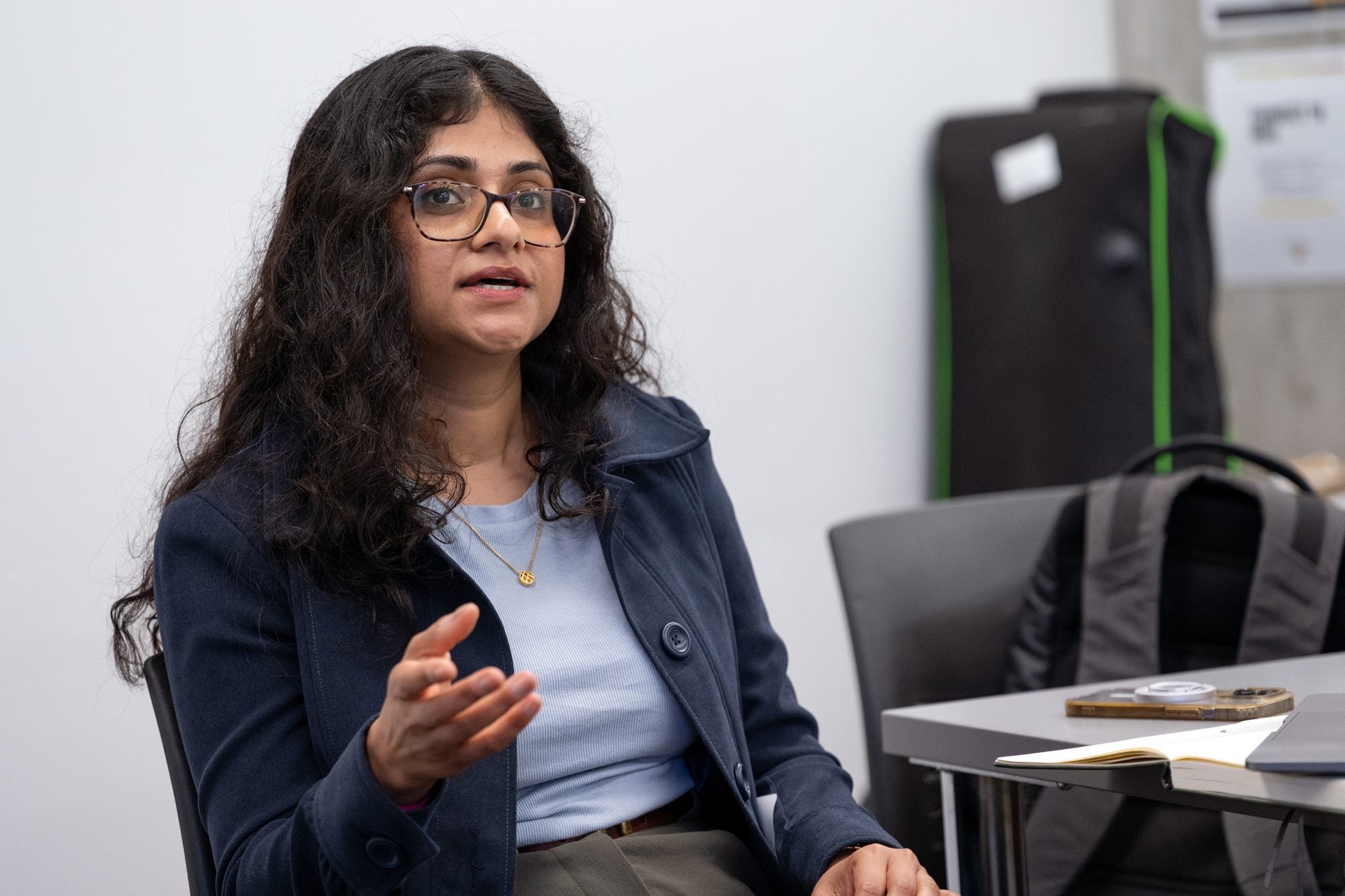 An attendee shares her thoughts during a discussion