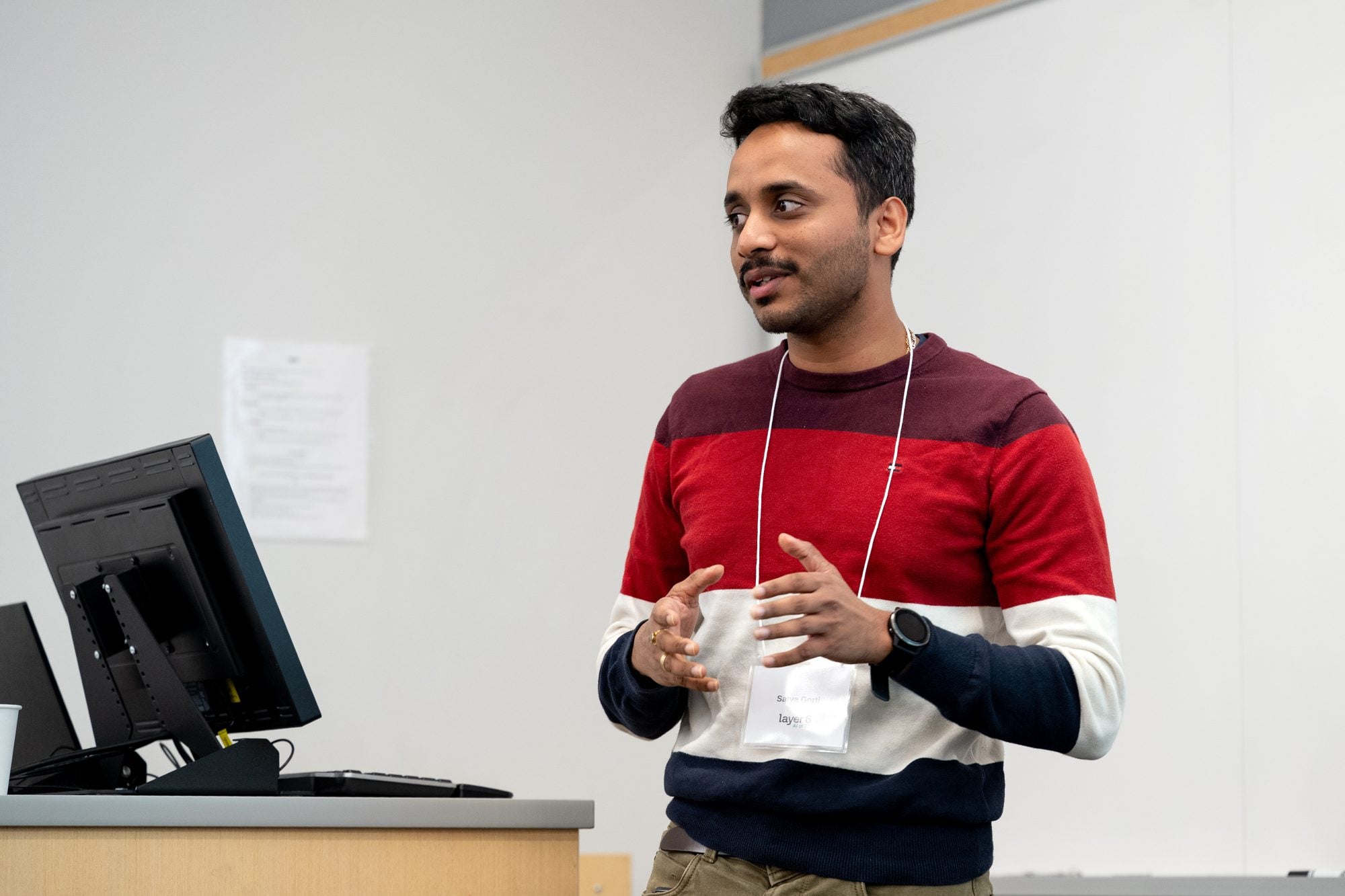 A faculty member presents his research during the TD Layer 6 visit