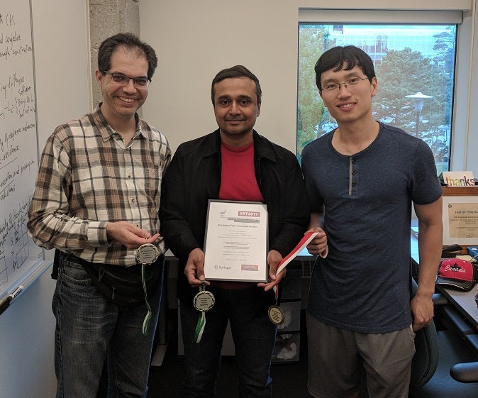 Photo of Prof Poupart and Prof Ganesh and Jimmy Liang, grad student