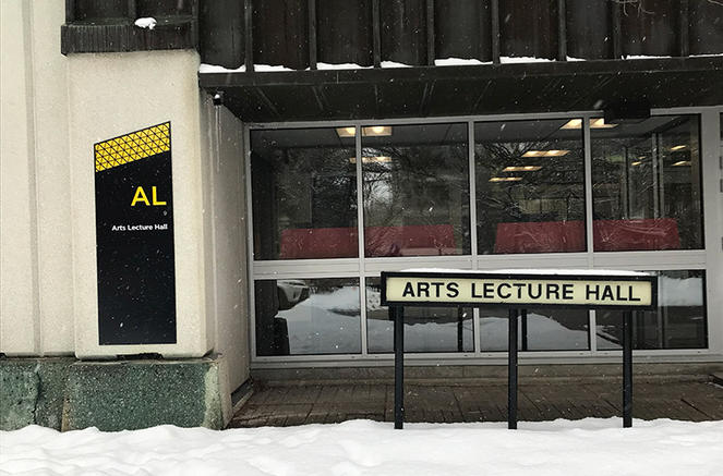 The old sign and the new sign for Arts Lecture Hall