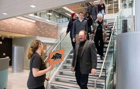 student leads tour in Hub