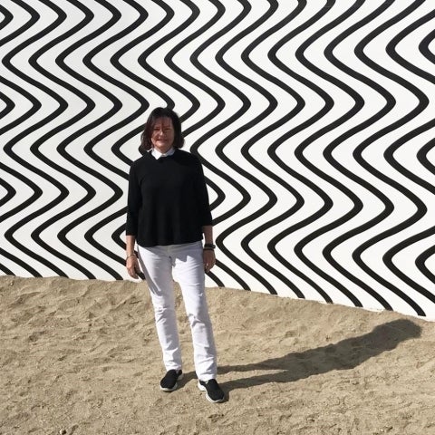 Lenora Hume in front of large artwork