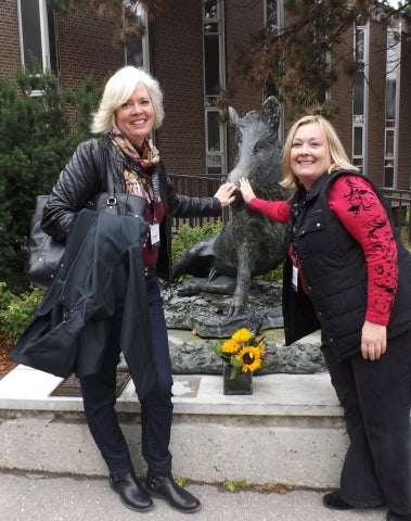 Nancy Mattes and Stephanie Massel with bronze boar
