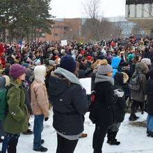 crowd of students, staff and faculty gathered outdoors in winter