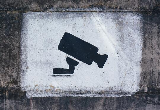 Stencil on a wall of a CTV camera