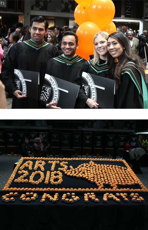 A group of happy new grads, and cupcakes laid out to form the shape of a boar