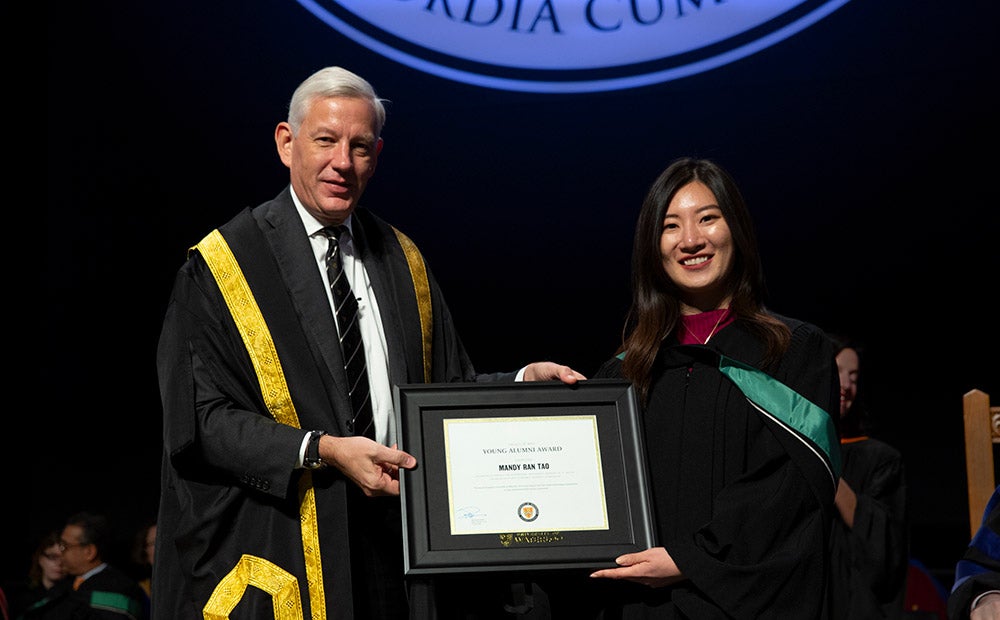 Mandy Tao receives her award from Chancellor Dominic Barton