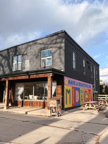 Shop with colourful mural on the exterior wall