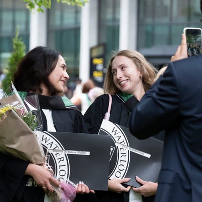 two students looking at eachother for a photo 