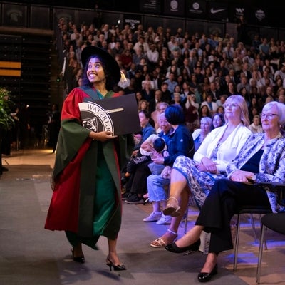 PHD student looking up  back at the stage