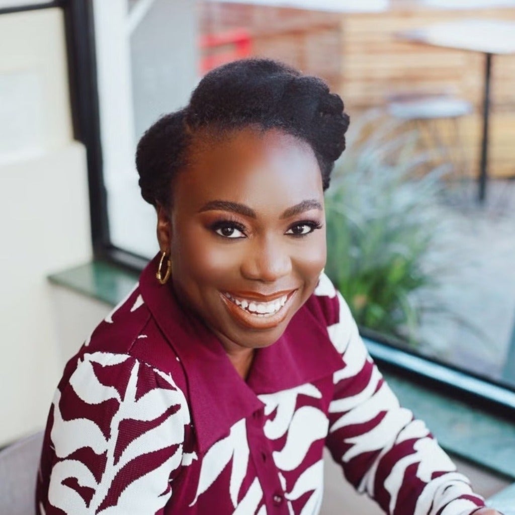 Eytemi Popo smiling with coffee