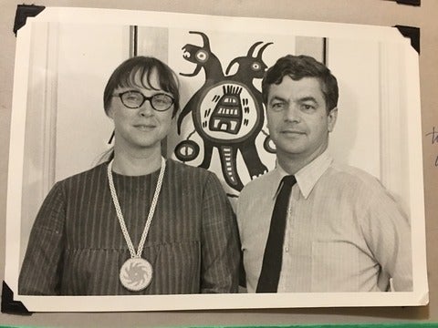 Nancy-Lou and Palmer Patterson in front of Indigenous artwork in the 1960s
