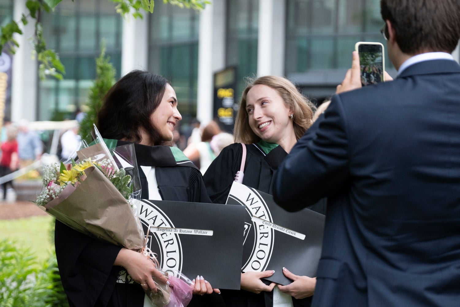 two students looking at eachother for a photo 
