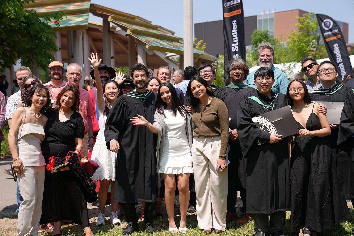 A big group of graduates, friends, and family