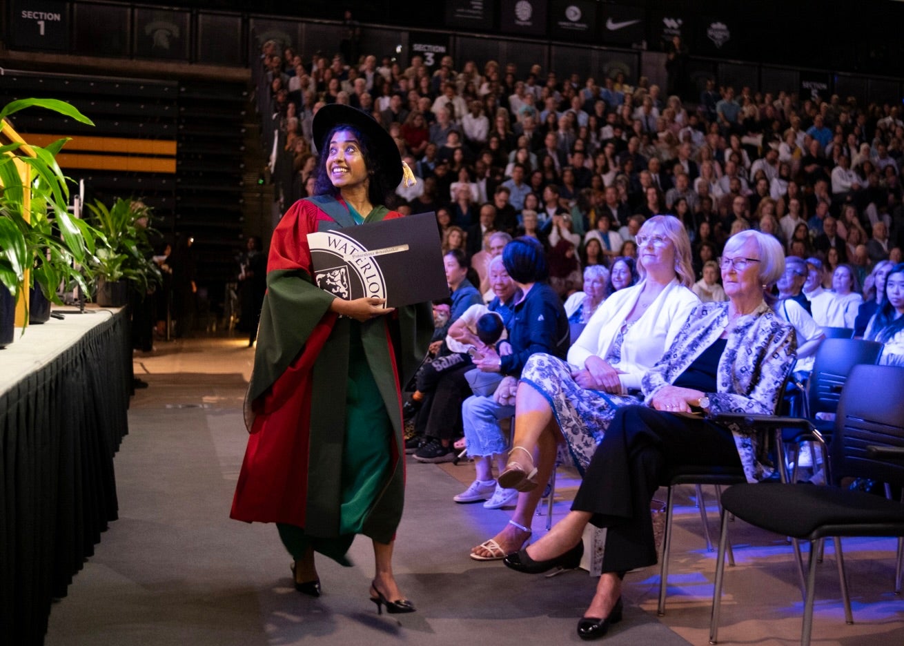 PHD student looking up  back at the stage