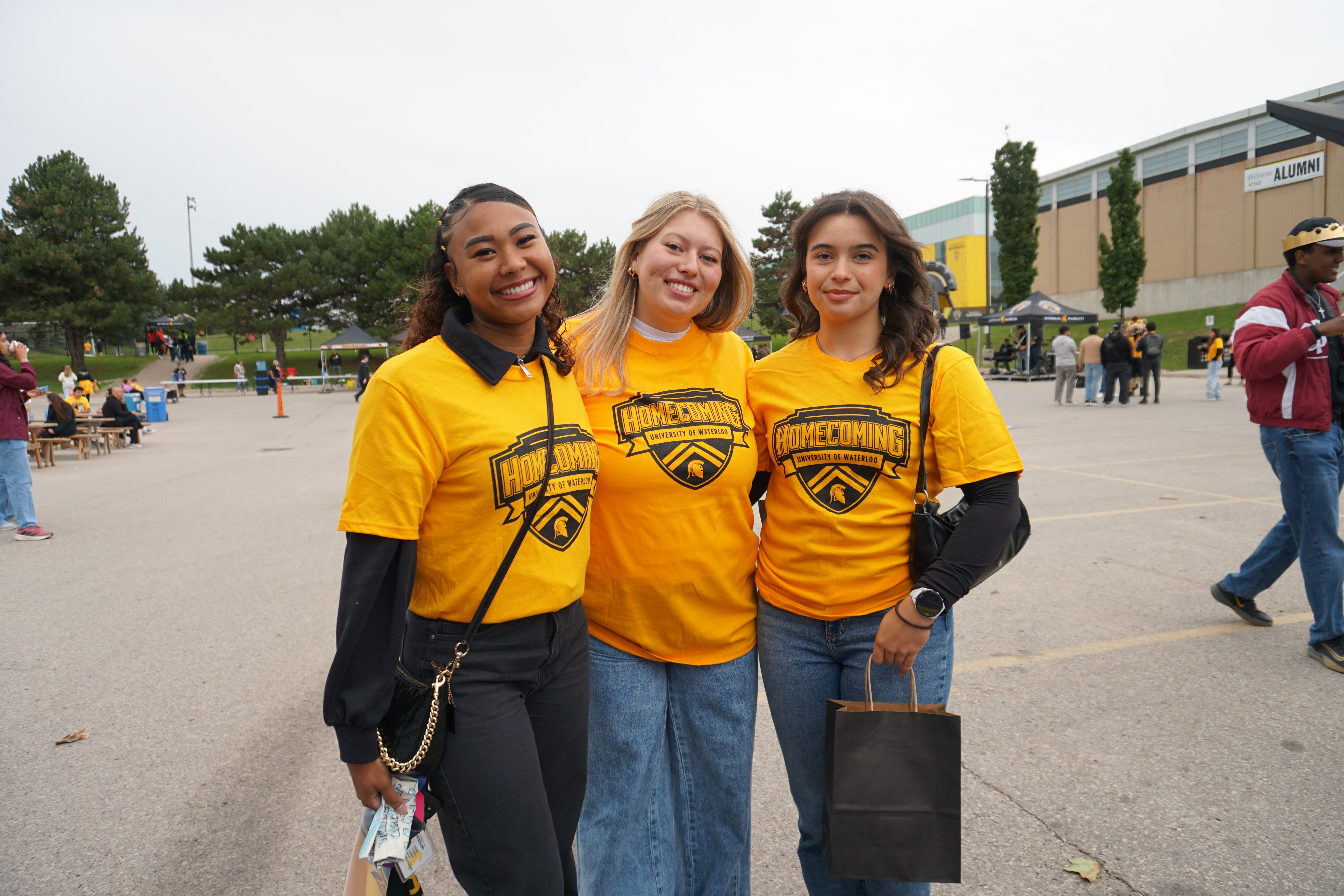 3 arts students enjoying parking lot party 