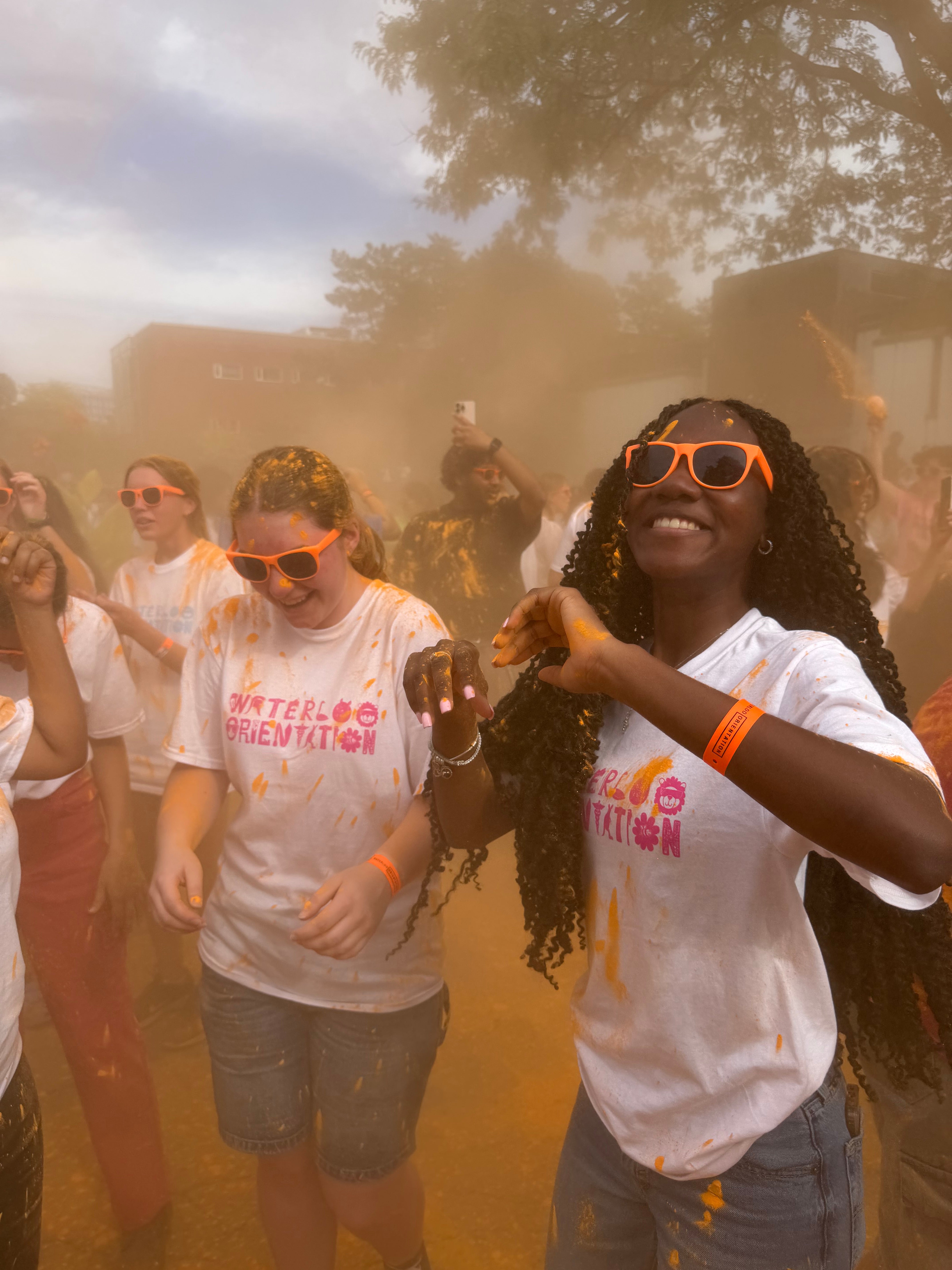 students dancing in the orange chalk throw 