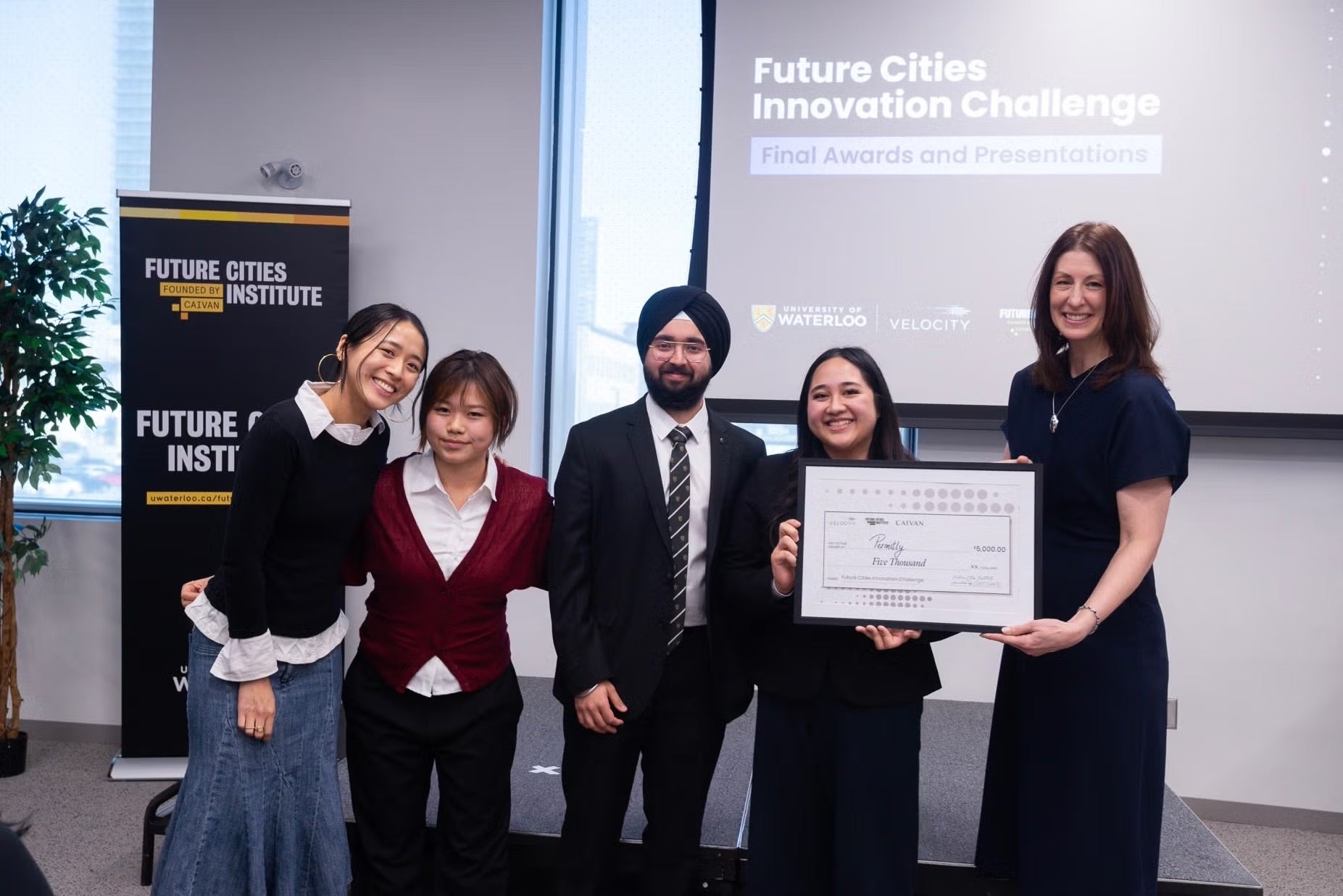 Sehaj stands with his Velocity pitch team to receive their award