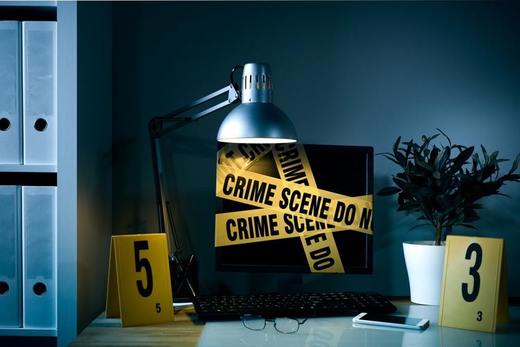 A computer wrapped with crime scene tape because they were preforming illegal online activities without following these steps