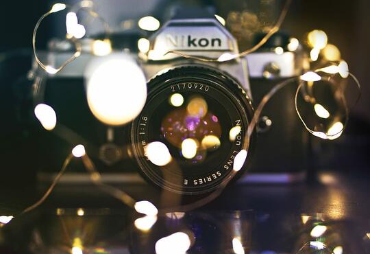 nikon camera and fairy lights.