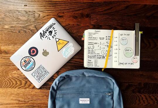 laptop and note book and bag