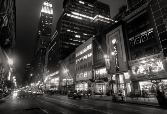 black and white image of city street.