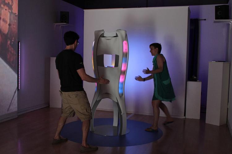 two people experimenting with the anyware sculpture