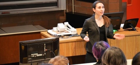 student Andria speaking in lecture hall