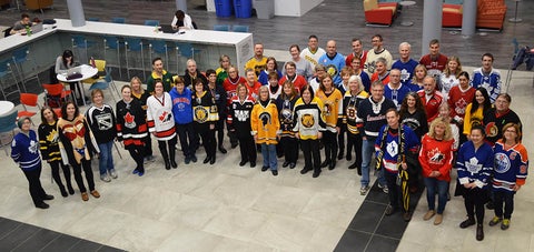 Arts staff and faculty wear hockey jerseys to show support for the Humboldt Broncos