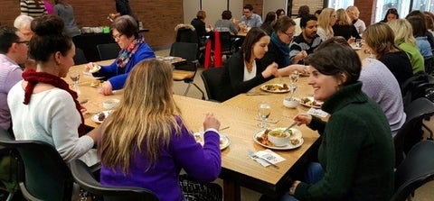 group of people eating at tables