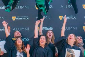 Joyous graduates tossing their hoods in the air