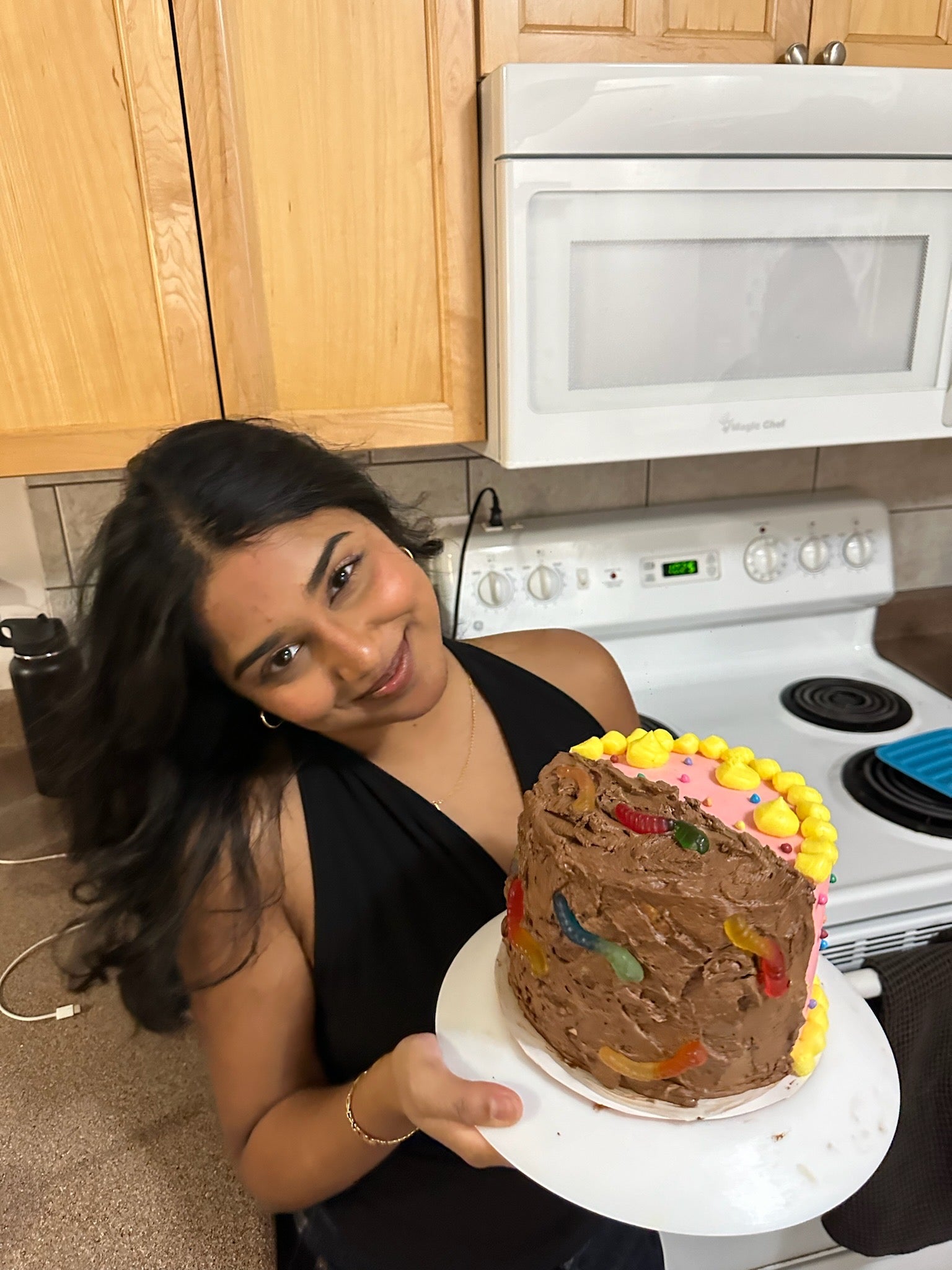 Hrushika holding a cake