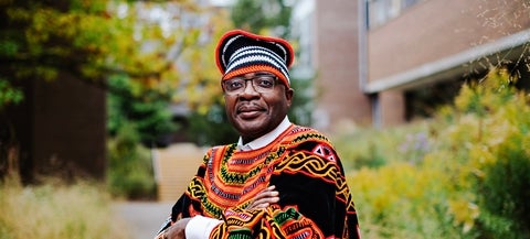 Dean Alexie Tcheuyap in traditional Cameroonian dress on UW campus