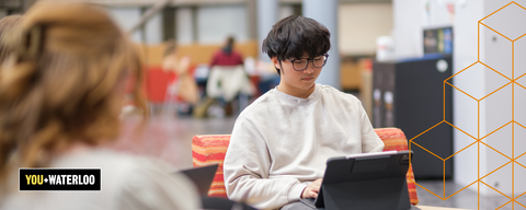 Student typing on laptop