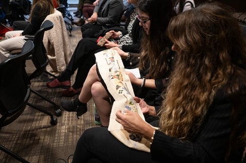 Audience look at embroiderd cloth