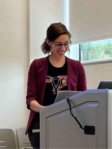 Eleanor presenting at an academic conference