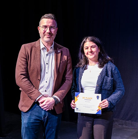 Emily Mashaal receiving her award