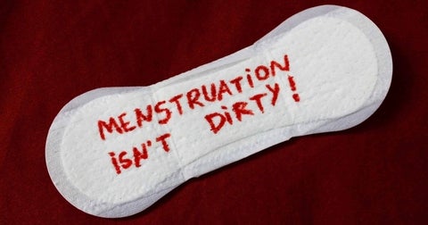 pad with words on blood saying Menstruation isn't dirty