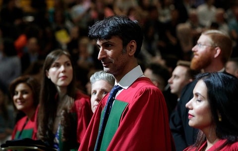 PhD graduates in robes at convocation ceremony