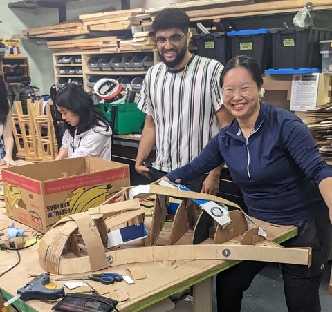 Students in studio building 3D cardboard bird