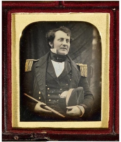 Archival photo of James Fitzjames in a 19th century British naval officer uniform with fringed epaulets, waistcoat and hat