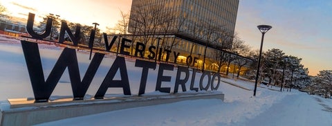 University of Waterloo large sign sculpture in wintery campus scene