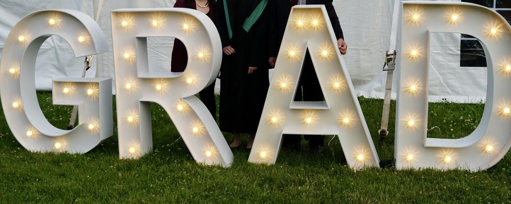 Large illuminated letters saying grad