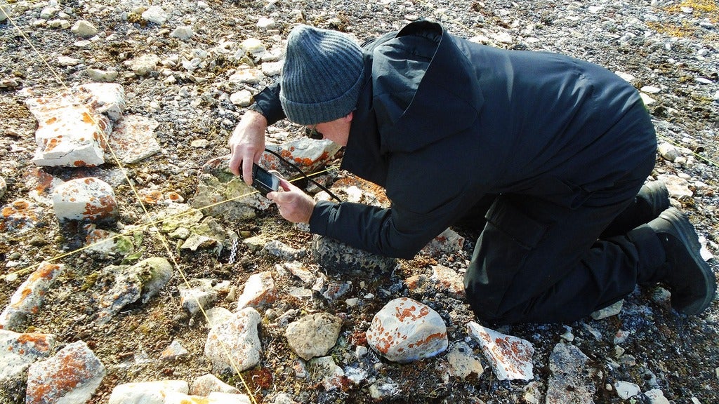Doug Stenton photographing site before excavation
