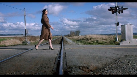 woman walking down rural road