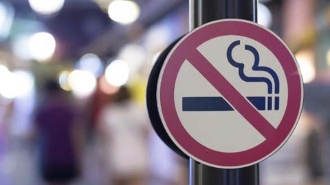 no smoking sign on city street