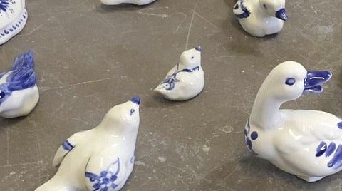 white and blue ceramic birds