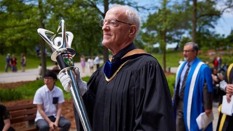 John North at convocation carrying the UWaterloo ceremonial mace