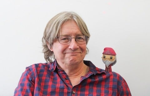 Neil Randall with puppet on his shoulder